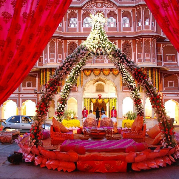 A floral mandap in an Indian palace courtyard